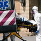 Medical workers load a body into an ambulance at Andover Subacute and Rehabilitation Center on April 16, 2020 in Andover, New Jersey.